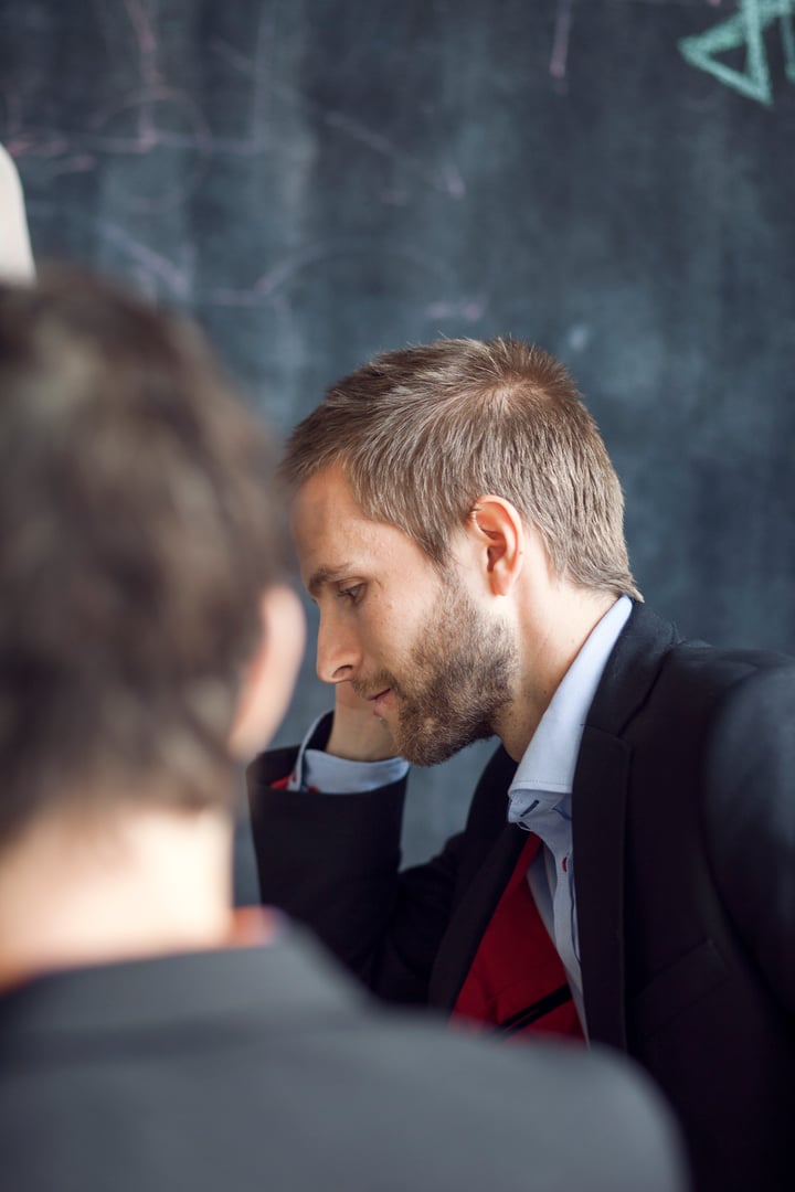 side-view-of-businessman-in-meeting-with-colleague-2024-10-17-13-09-16-utc