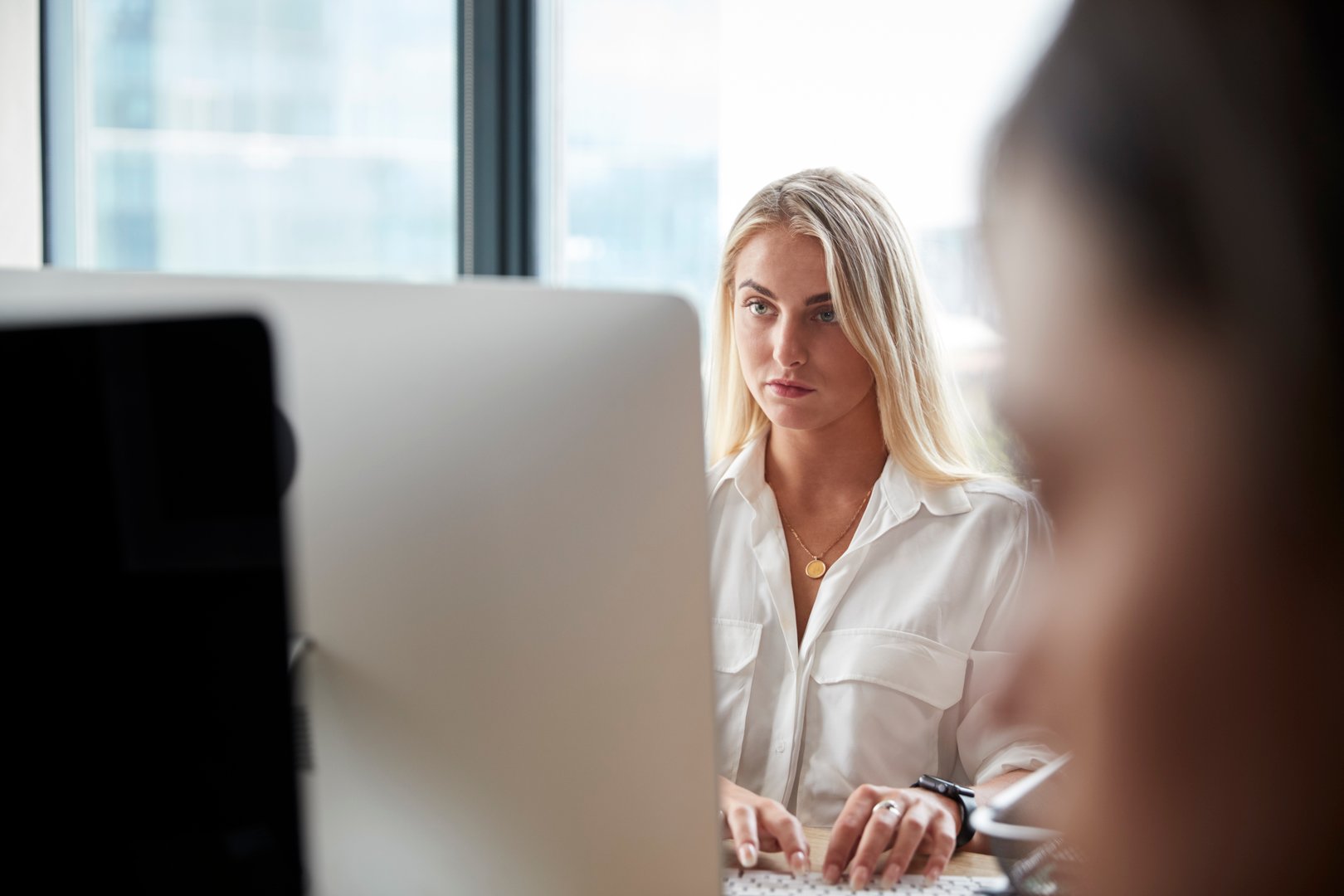 young-white-blonde-woman-working-at-a-computer-in-2024-10-19-05-58-55-utc